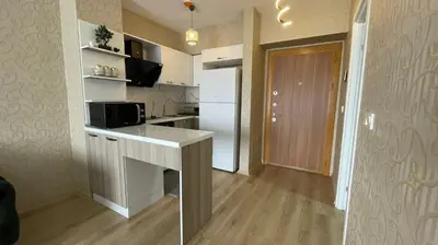 a small kitchen with a counter and a microwave at Luxe Suite AI3 in Esenyurt