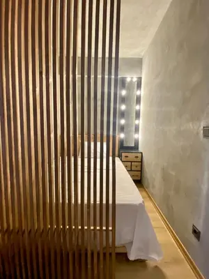 a bedroom with a bed with a wooden headboard at BlokNoi in Istanbul