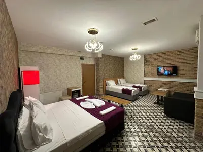 a hotel room with a bed and a couch at Gran Brn Hotel Taksim in Istanbul