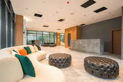 a living room with a couch and a fireplace at SHERLOCK HOMES HOTELS in Istanbul