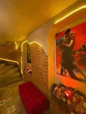 a room with a painting of a man hugging a woman at Golden Arrow Hotel in Istanbul