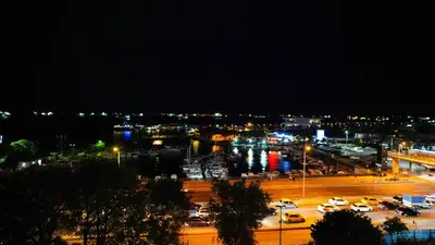 a city at night with cars parked in a parking lot at AURA MARINA HOTEL in Istanbul