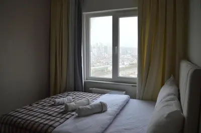 a bedroom with a bed with two pillows and a window at Classic Suite MS34 in Istanbul