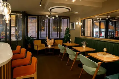 a restaurant with tables and chairs in a room at Aleksandr Pera Hotel in Istanbul