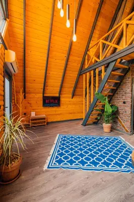 a large room with a blue rug on the floor at Dark Sapanca in Sapanca