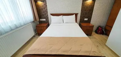 a bedroom with a large bed with two night stands at Cihangir Flat in Istanbul