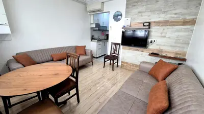 a living room with a couch and a table at Cihangir Flat in Istanbul