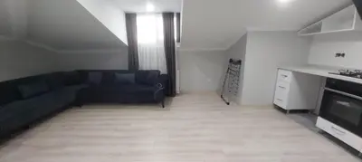 a living room with a couch and a kitchen at GANİGAR alibeyköy in Istanbul
