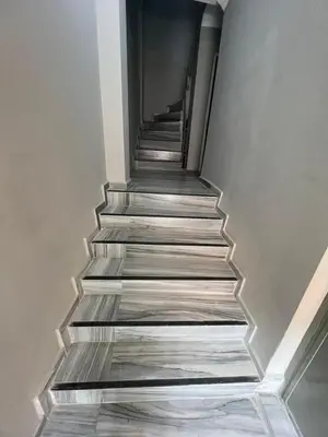 a stairway with wooden steps in a building at GRAND Deniz Hotel in Istanbul