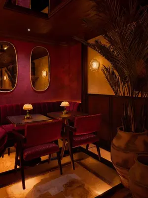 a restaurant with two tables and a potted plant at Shining Star Hotel in Istanbul