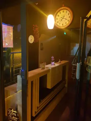 a room with a clock on the wall and a counter at Retro Suites in Istanbul