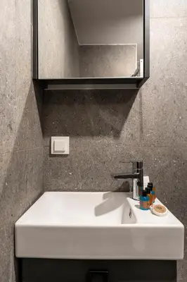 a white sink in a bathroom with a mirror at Sayeban Gold Hotel in Istanbul