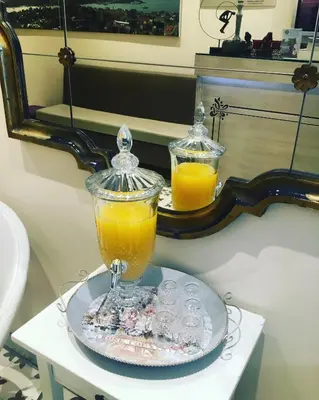 two glasses of orange juice sitting on a table at Wame Suite Hotel Nisantasi in Istanbul
