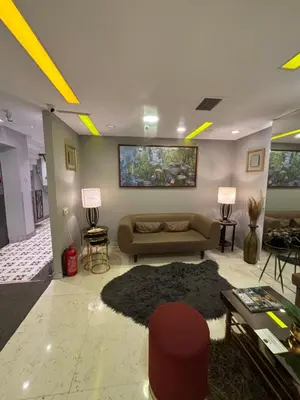a living room with a couch and a rug at Wame Suite Hotel Nisantasi in Istanbul