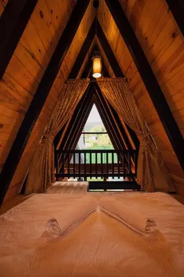 a large bed in a room with a window at KARMATTE BUNGALOW in Kartepe
