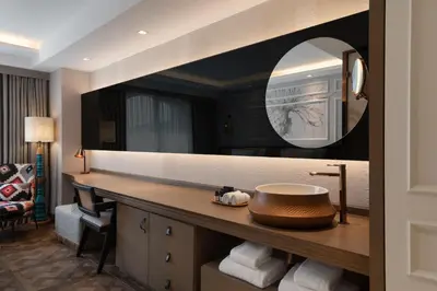 a bathroom with a sink and a mirror at Burdock Hotel Istanbul, Autograph Collection in Istanbul