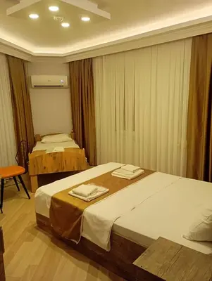 a hotel room with two beds with towels on them at Vento in Istanbul