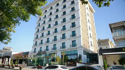 a large white building on a city street at Vois Hotel Atasehir & SPA in Istanbul