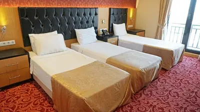 a hotel room with two beds in a room at Vois Hotel Atasehir & SPA in Istanbul