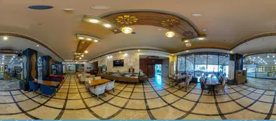 a large lobby with tables and chairs in a building at Vois Hotel Atasehir & SPA in Istanbul