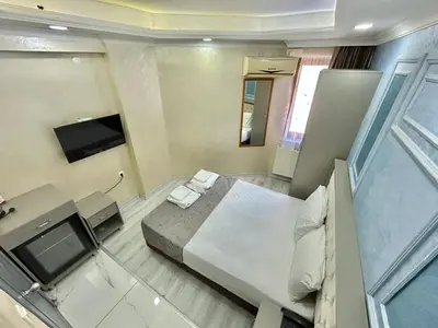 an overhead view of a bedroom with a bed and a television at Grand Kybele Hotel in Istanbul