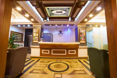 a stage in a room with chairs and a table at Hotel Black Pearl in Istanbul