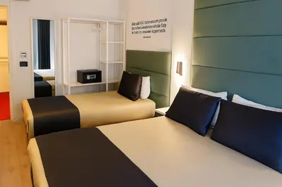 a room with two beds in a hotel room at AXU AIRPORT HOTEL in Arnavutköy