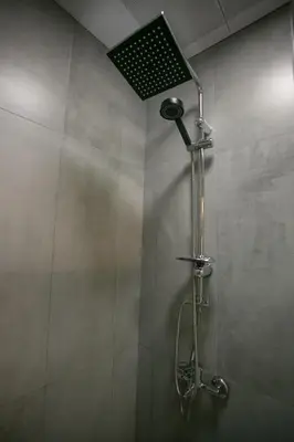 a shower with a shower head in a bathroom at BLAU GRÜN İSTANBUL OTEL in Istanbul