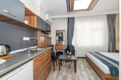 a hotel room with a sink and a bed at La Serena Taxim Hotel in Istanbul