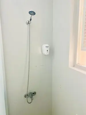 a shower with a shower head in a bathroom at White Suites Hotel İstanbul in Istanbul