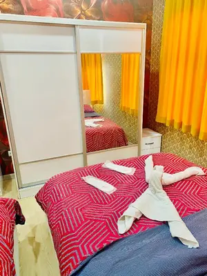 a bedroom with a bed with a large mirror at White Suites Hotel İstanbul in Istanbul