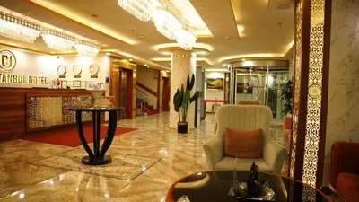a lobby of a hotel with a chair and a table at El Emin İstanbul Hotel in Istanbul