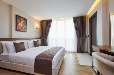 a hotel room with a bed and a window at Trademark Collection By Wyndham Operla İstanbul Airport Hotels & Spa in Arnavutköy