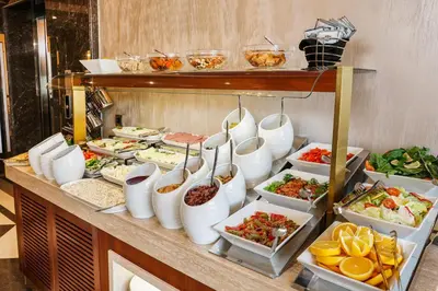 a buffet with a lot of food on a table at MANORS HOTEL in Istanbul