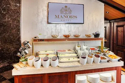 a buffet line with sandwiches and other food items at MANORS HOTEL in Istanbul