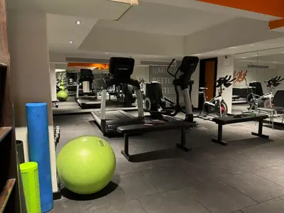 a gym with a green exercise ball and exercise bikes at Ulus G Residences in Istanbul