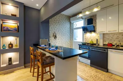a kitchen with a table and chairs in a room at Cihangir rooms in Istanbul