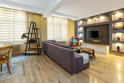a living room with a couch and a fireplace at Cihangir rooms in Istanbul