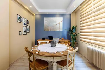 a dining room with a table and chairs at Cihangir rooms in Istanbul