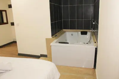 a bathroom with a white tub in a room at biglife hotel in Istanbul