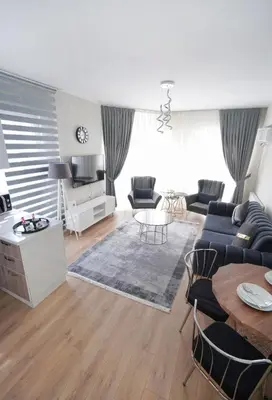 a living room with a couch and a table at King Suite TH28 in Esenyurt