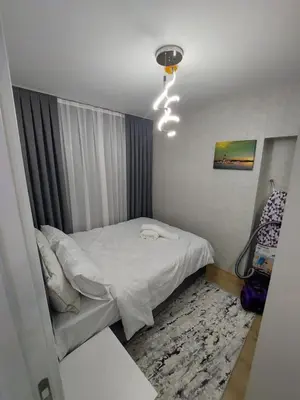 a small bedroom with a bed and a window at Classic Suite TS32 in Esenyurt