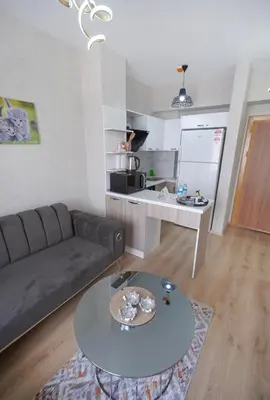 a living room with a couch and a table at Classic Suite TS23 in Esenyurt