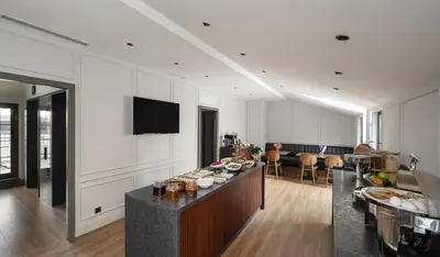 a living room with a table with food on it at Livro Hotel in Istanbul