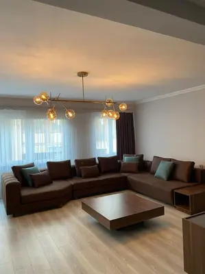 a living room with a couch and a coffee table at Whole Apartment at The Heart of Sisli Nisantasi K in Istanbul