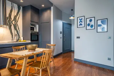 a kitchen and dining room with a table and chairs at Benesta Guest Teori in Istanbul