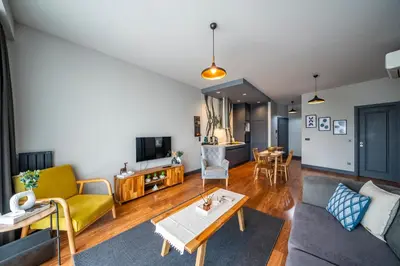 a living room with a couch and a table at Benesta Guest Teori in Istanbul