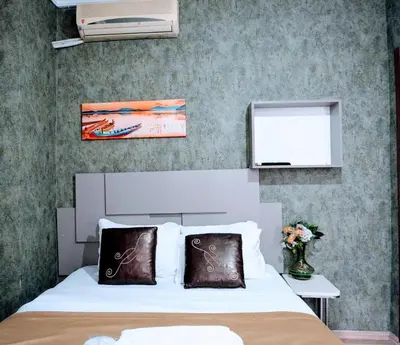 a bedroom with a bed and a window at Easeinn in Istanbul