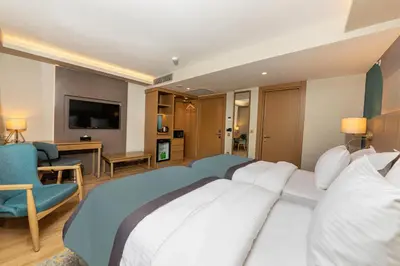 a hotel room with a large bed and a television at Csk The Halich Port İstanbul in Istanbul