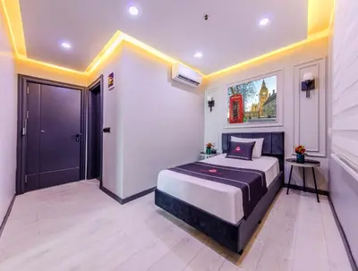 a bedroom with a king sized bed in a room at Intercity Hotel Istanbul Airport in Arnavutköy